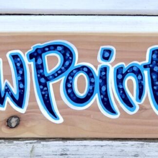 Hand painted sign on wood with shells and a beach scene with palm trees and a blue sky with a yellow sun